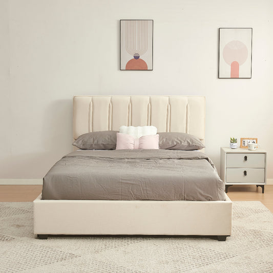 Beige upholstered bed with gray bedding in a bedroom setting.